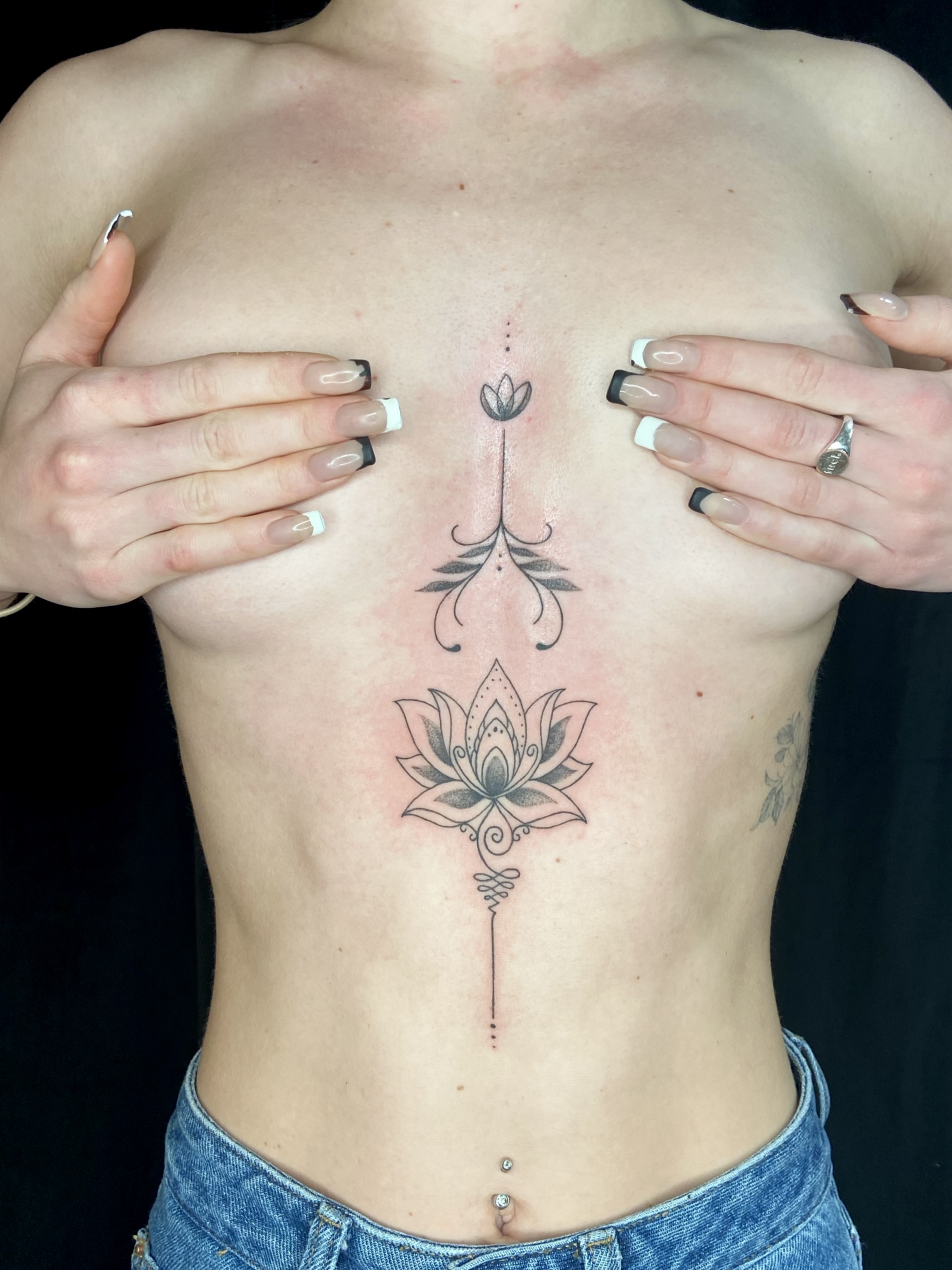 Detailed ornamental sternum tattoo by Embodiment of Ink
